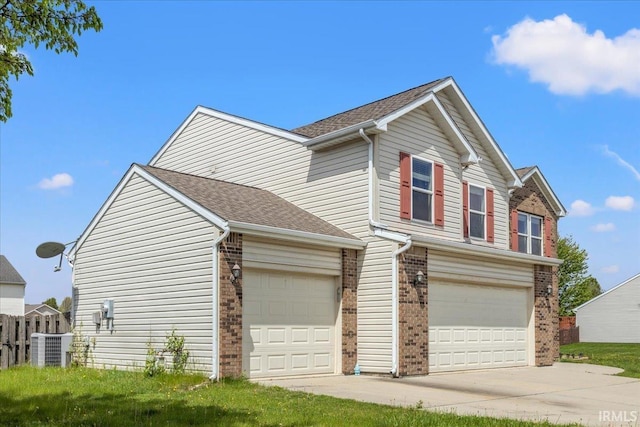 view of front facade featuring driveway, a garage, brick siding, cooling unit, and a shingled roof