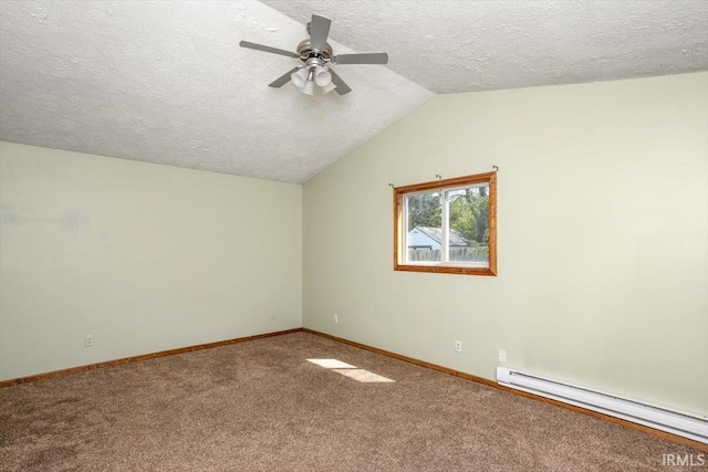 spare room with baseboards, baseboard heating, a textured ceiling, a ceiling fan, and carpet
