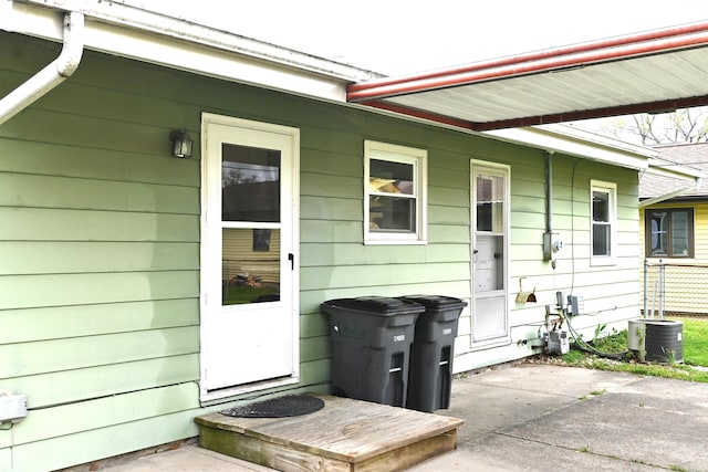 property entrance featuring a patio