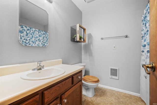 full bathroom featuring tile patterned flooring, vanity, baseboards, toilet, and heating unit