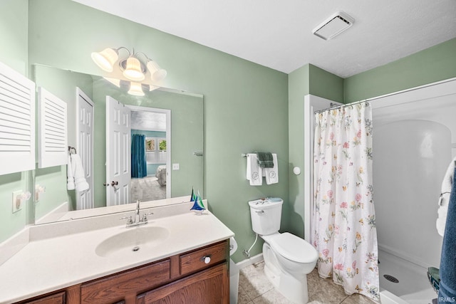 bathroom with toilet, visible vents, a shower stall, and vanity