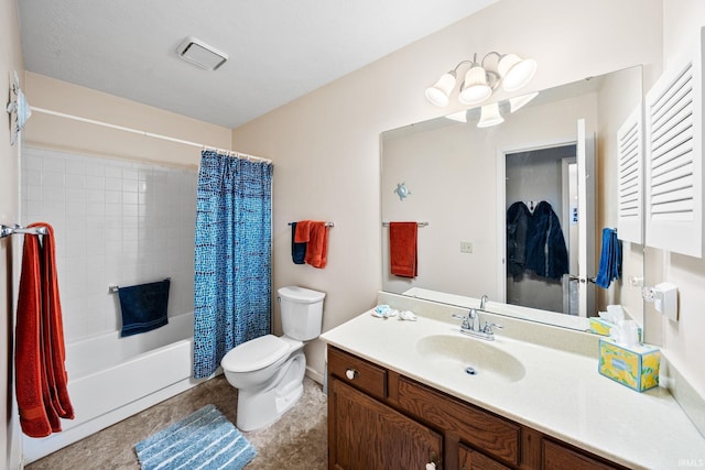 bathroom with vanity, shower / tub combo with curtain, and toilet