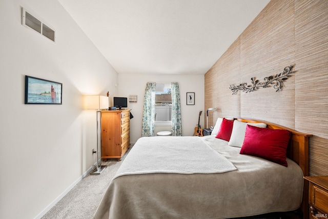 carpeted bedroom with visible vents and baseboards
