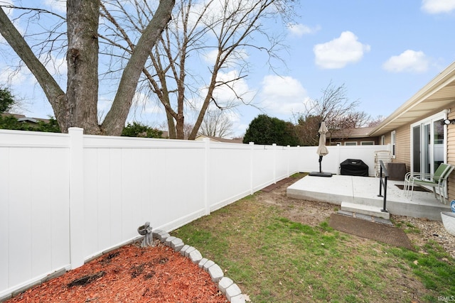 view of yard with a fenced backyard and a patio
