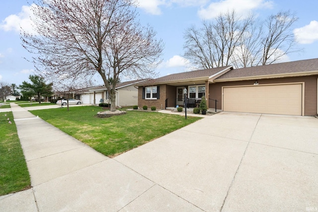 single story home with a porch, an attached garage, driveway, and a front yard