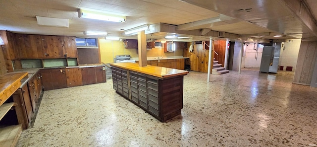 kitchen with brown cabinetry and heating unit