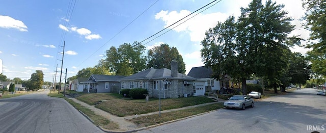 view of front facade featuring a chimney