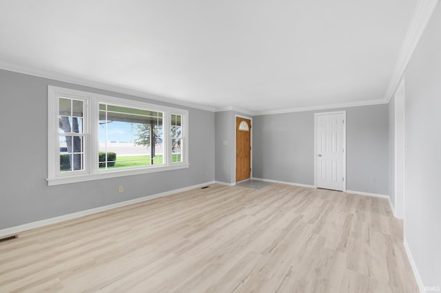 9231 Minnich Rd, Fort Wayne, IN 46816 - spare room with baseboards, ornamental molding, and light wood finished floors