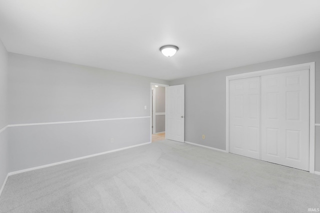 9231 Minnich Rd, Fort Wayne, IN 46816 - unfurnished bedroom featuring a closet, carpet, and baseboards