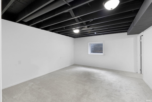 9231 Minnich Rd, Fort Wayne, IN 46816 - below grade area featuring baseboards and carpet