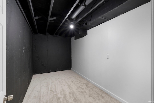 9231 Minnich Rd, Fort Wayne, IN 46816 - finished below grade area featuring carpet flooring and baseboards