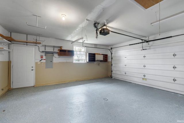9231 Minnich Rd, Fort Wayne, IN 46816 - garage featuring a garage door opener and electric panel
