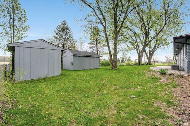 9231 Minnich Rd, Fort Wayne, IN 46816 - view of yard with an outbuilding, a storage shed, and central AC unit