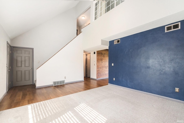 unfurnished living room with baseboards, carpet flooring, and visible vents