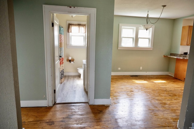 1517 S 11th St, Goshen, IN 46526 - hall featuring baseboards, hardwood / wood-style flooring, and visible vents
