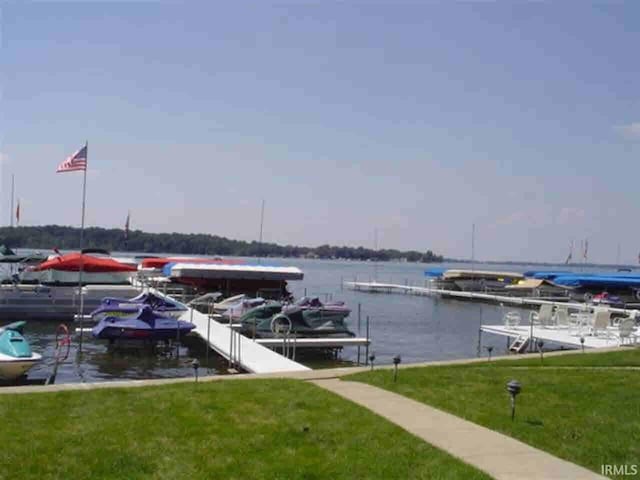 10035 N Turkey Creek Rd, Syracuse, IN 46567 - view of dock featuring a water view and a yard