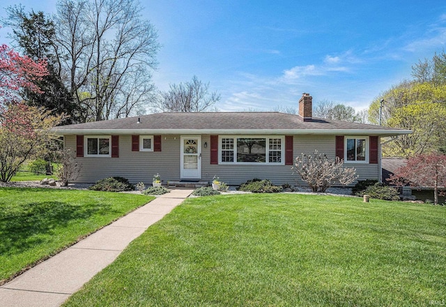 29130 County Road 22, Elkhart, IN 46517 - ranch-style home with roof with shingles, a chimney, and a front lawn