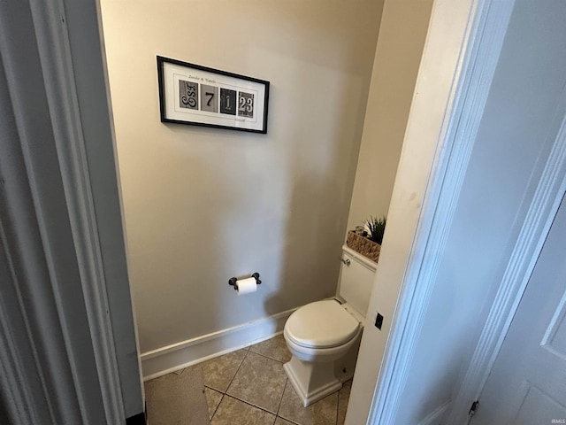 13546 Brick Rd, Granger, IN 46530 - bathroom featuring baseboards, tile patterned floors, and toilet
