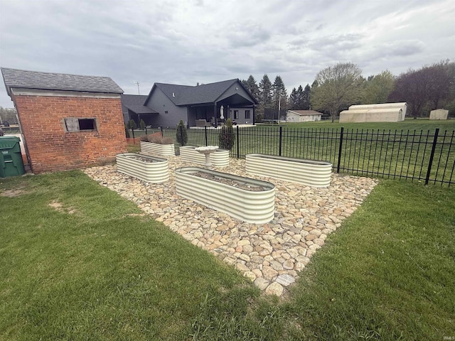 13546 Brick Rd, Granger, IN 46530 - view of yard featuring fence and a vegetable garden