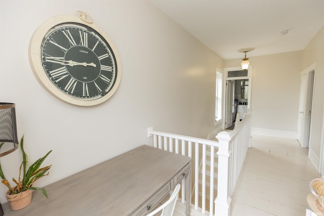 13546 Brick Rd, Granger, IN 46530 - hallway featuring baseboards and an upstairs landing