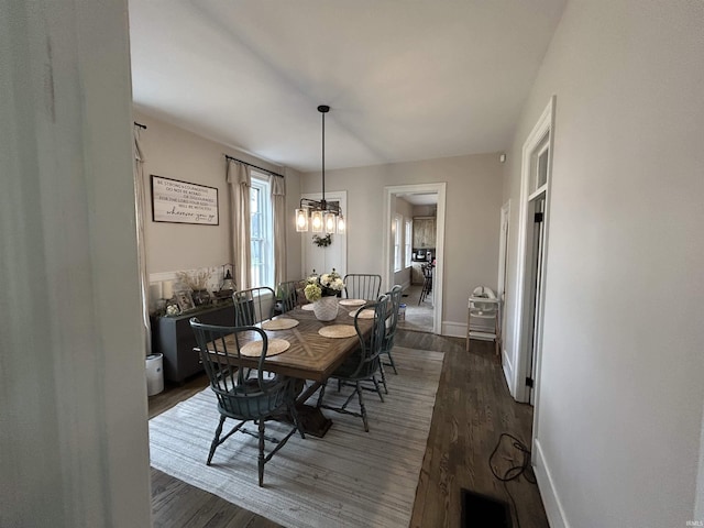 13546 Brick Rd, Granger, IN 46530 - dining room with baseboards, a chandelier, dark wood-style floors, and visible vents