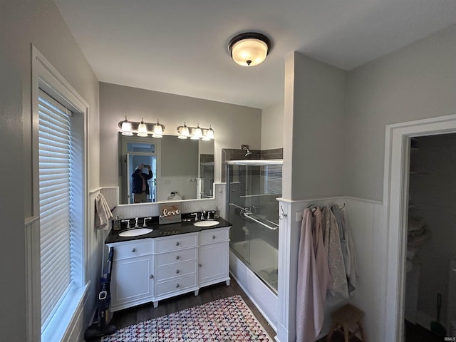 13546 Brick Rd, Granger, IN 46530 - bathroom featuring wainscoting, a sink, and a stall shower