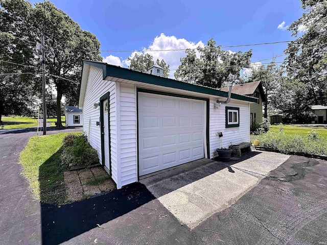 garage featuring driveway