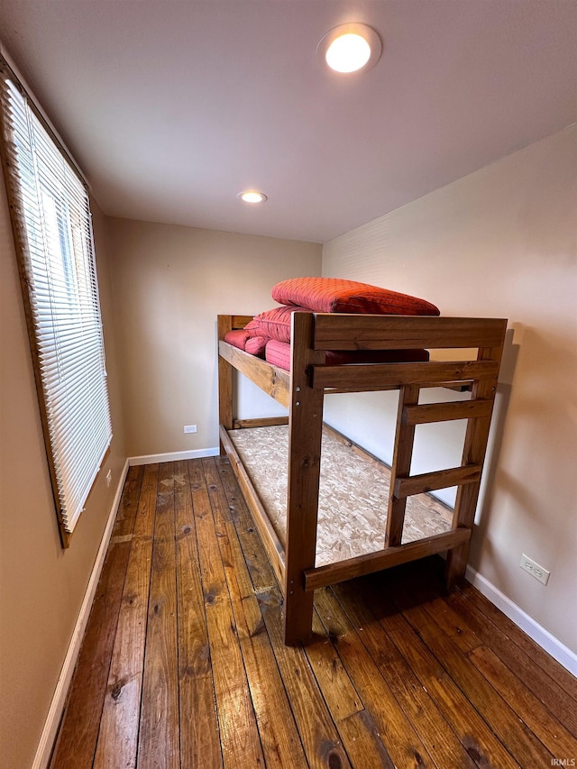 unfurnished bedroom with baseboards, recessed lighting, and hardwood / wood-style floors