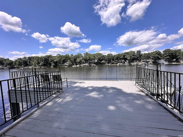 wooden deck featuring a water view