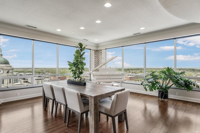 dining area with crown molding, recessed lighting, a textured ceiling, and dark wood-style floors