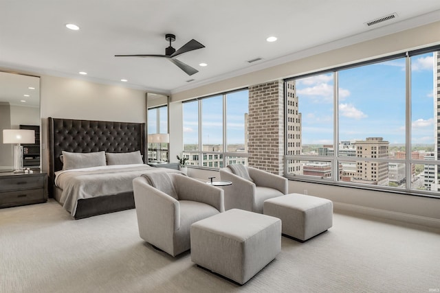 bedroom with carpet floors, a city view, recessed lighting, and visible vents