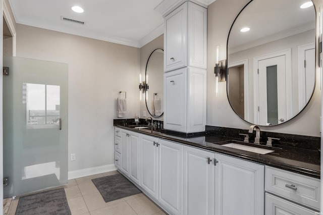 bathroom featuring a sink, crown molding, double vanity, and visible vents