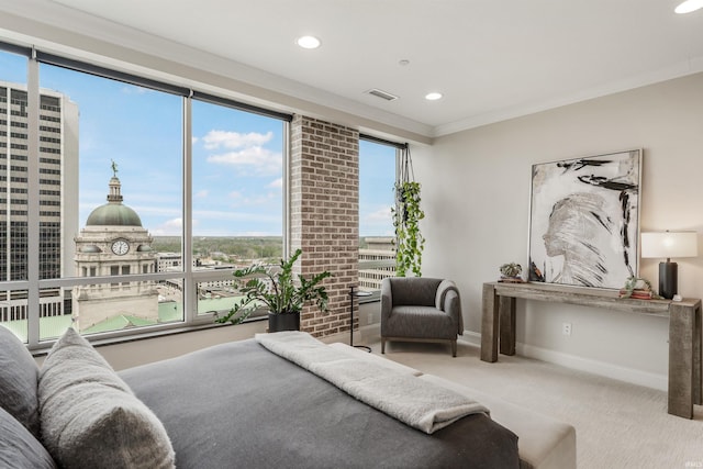 carpeted bedroom featuring visible vents, recessed lighting, baseboards, and crown molding