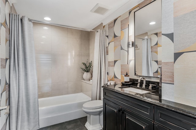 full bathroom with visible vents, shower / tub combo with curtain, vanity, toilet, and tile patterned floors