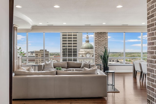 living area featuring recessed lighting and hardwood / wood-style flooring