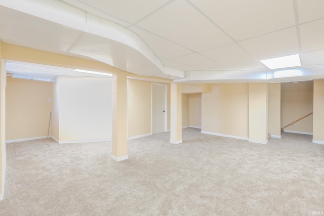 finished basement featuring carpet floors and baseboards