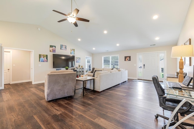living room with baseboards, a ceiling fan, dark wood-style floors, and high vaulted ceiling