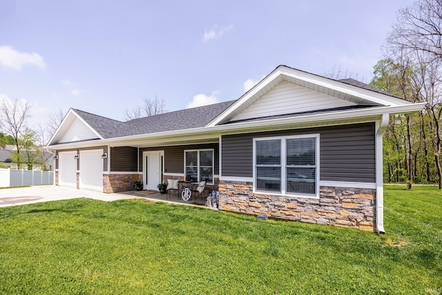 view of front of home featuring a shingled roof, an attached garage, a front lawn, stone siding, and concrete driveway