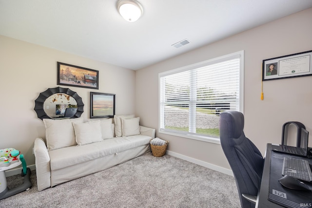 home office with carpet floors, baseboards, and visible vents
