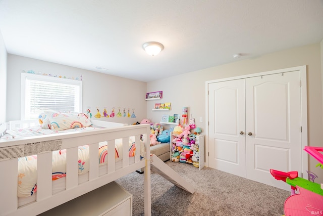 bedroom with a closet and carpet flooring