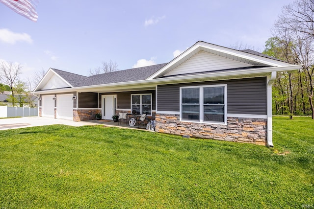 view of front of house with driveway, roof with shingles, a garage, a front lawn, and stone siding
