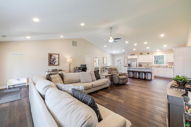 living area with ceiling fan, visible vents, dark wood finished floors, lofted ceiling, and recessed lighting