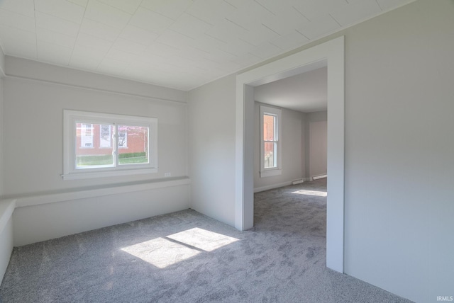 219 E S A St, Gas City, IN 46933 - spare room featuring carpet floors and a healthy amount of sunlight
