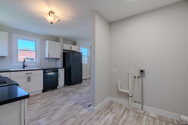 219 E S A St, Gas City, IN 46933 - kitchen featuring dark countertops, a sink, baseboards, white cabinets, and black appliances