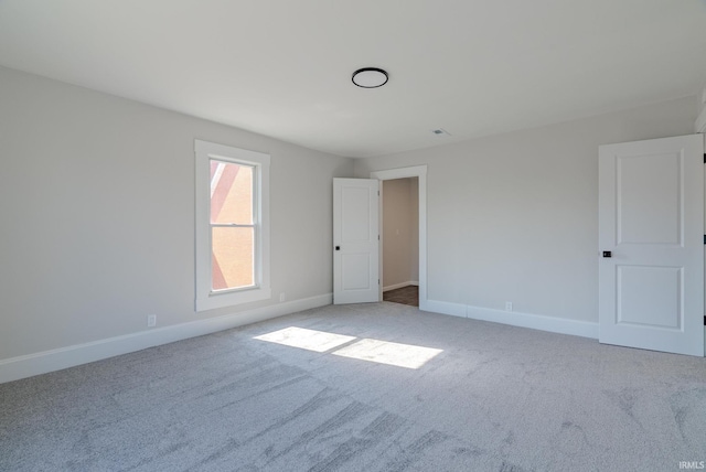 219 E S A St, Gas City, IN 46933 - unfurnished bedroom featuring baseboards and light carpet