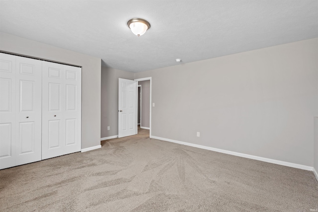 51779 Hannigan Dr, South Bend, IN 46637 - unfurnished bedroom featuring baseboards, carpet flooring, and a closet