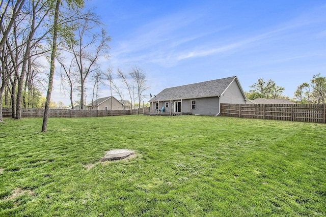 view of yard with a fenced backyard
