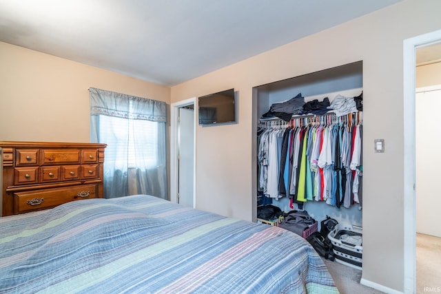 bedroom with a closet and carpet flooring