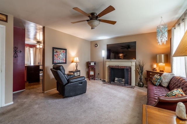 living area with a healthy amount of sunlight, carpet floors, and a ceiling fan