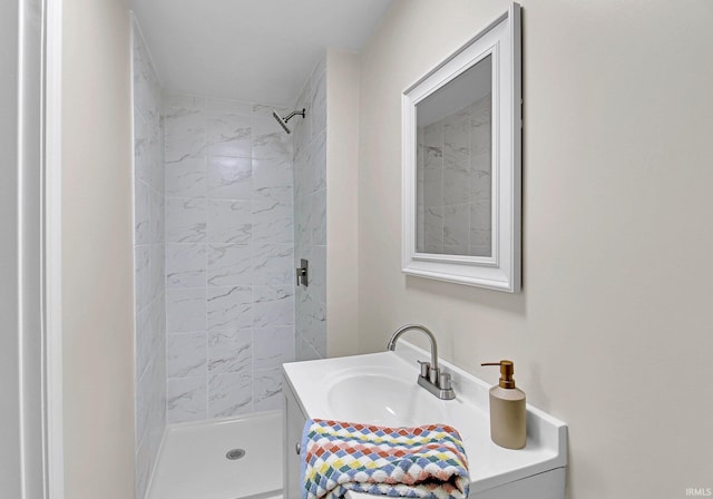 bathroom featuring a shower stall and vanity